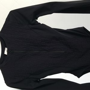 Trina Turk women's (s) black one piece swim suit with long sleeves.